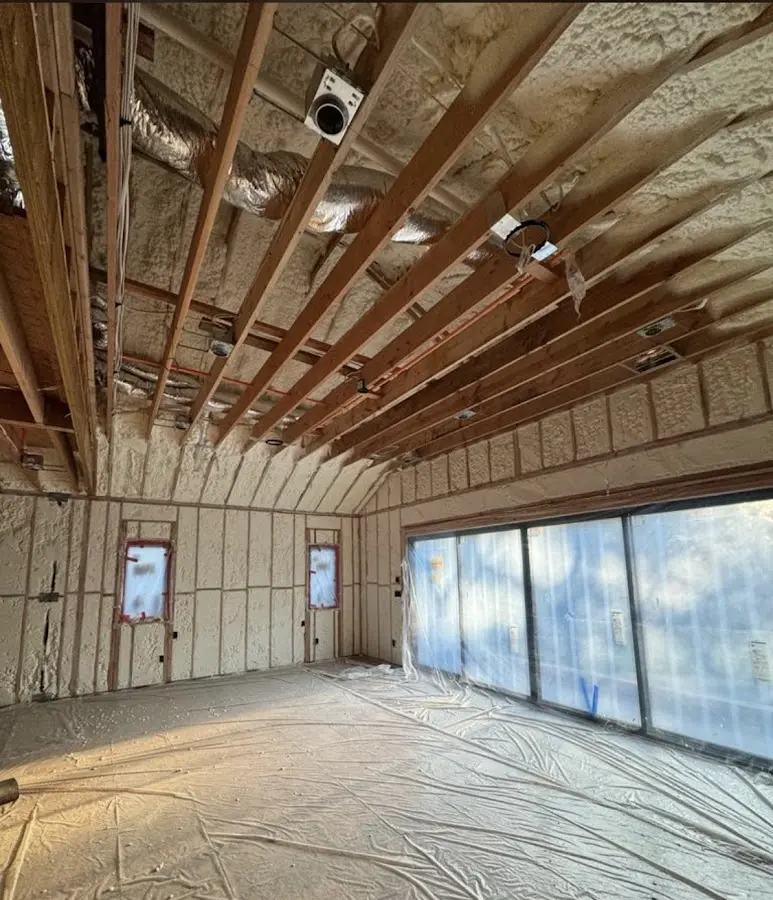 Interior walls and ceiling insulated with spray foam during new construction in White City